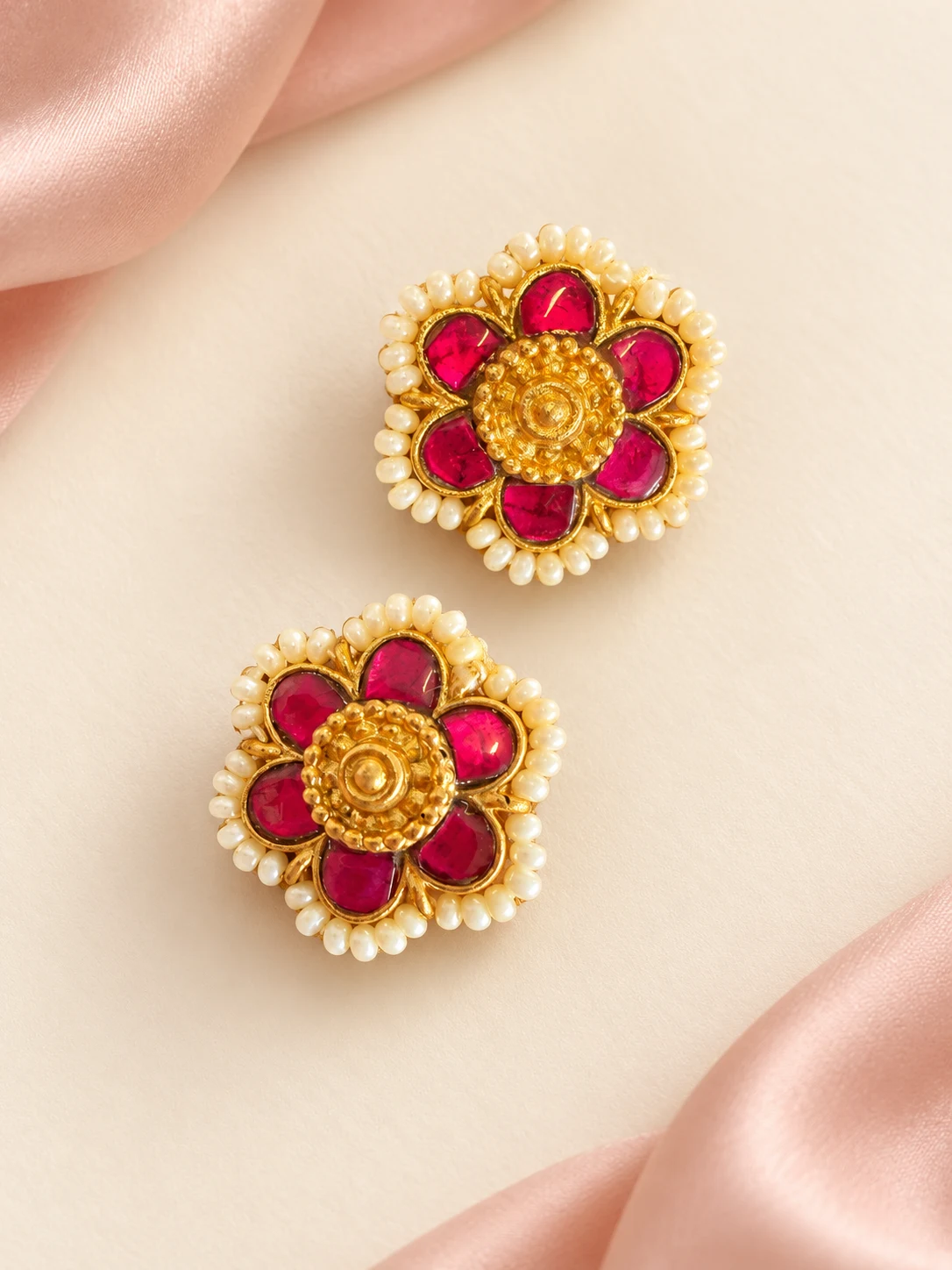 Pink Petal Pearl-Border Studs — main view on an ivory and blush background